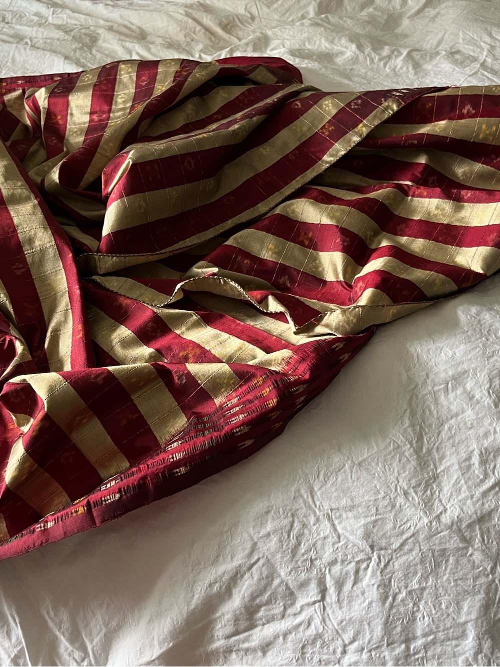 Striped Red and Gold Handloom Ikat Silk Saree with matching sleeveless blouse